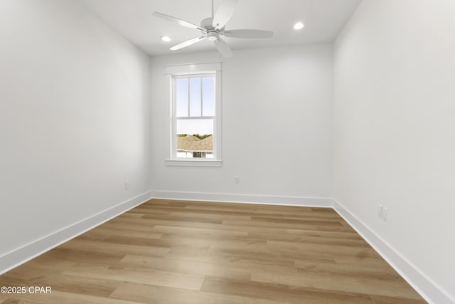 spare room featuring ceiling fan, recessed lighting, light wood-style flooring, and baseboards