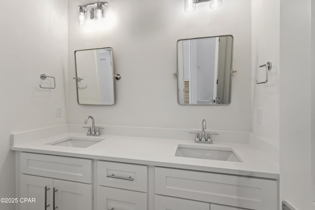 bathroom featuring double vanity and a sink