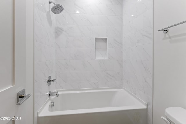 bathroom with toilet and shower / bathtub combination