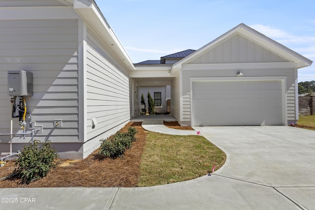 view of front facade featuring a garage, concrete driveway, and board and batten siding