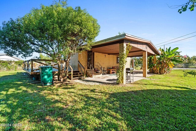 view of yard with a patio area and a playground