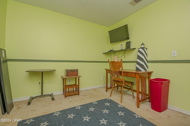 carpeted office space with lofted ceiling