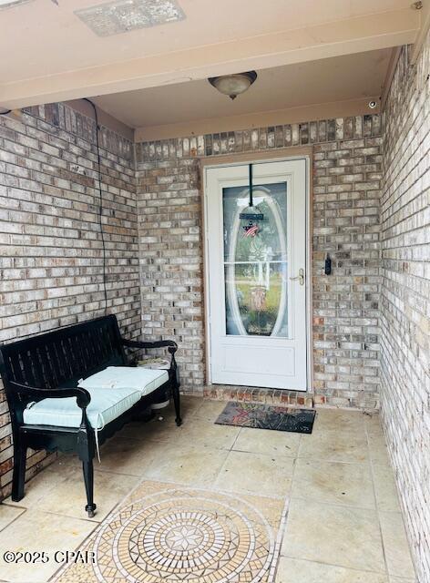 doorway to property featuring a patio area