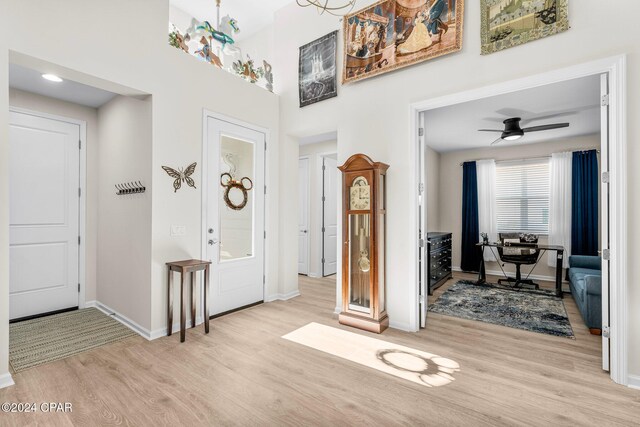 foyer featuring ceiling fan and light hardwood / wood-style flooring