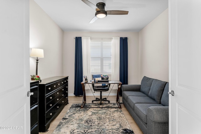 office space with ceiling fan and light hardwood / wood-style flooring