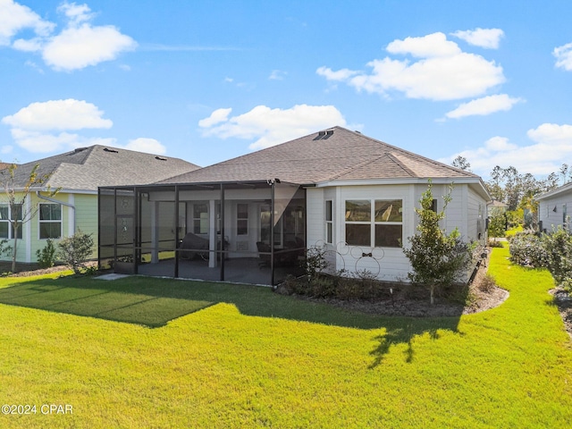 back of house with a yard