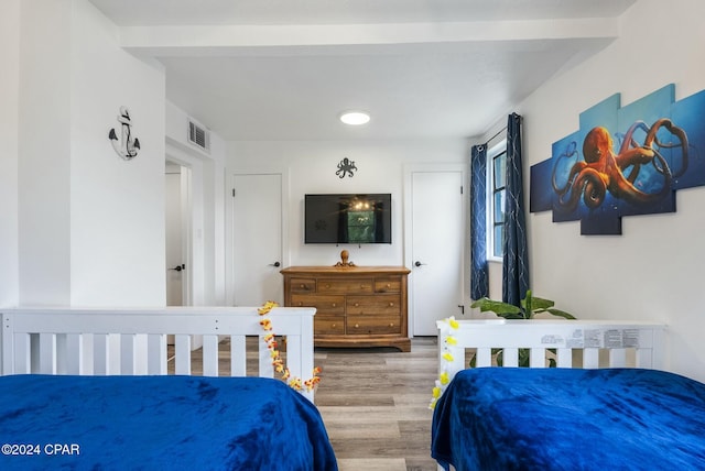 bedroom with hardwood / wood-style flooring