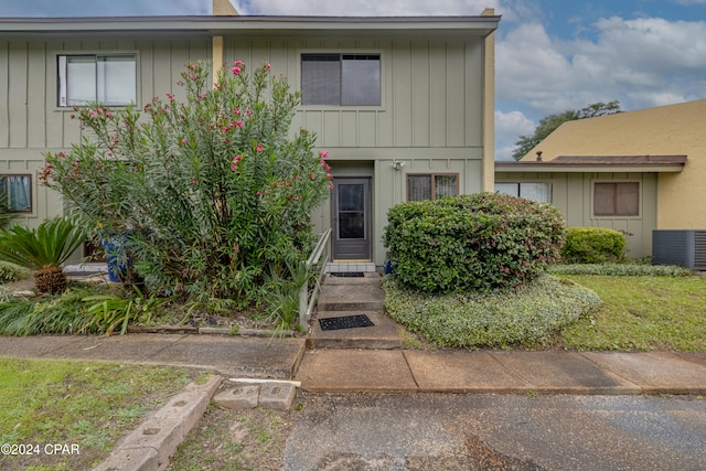 view of front of home featuring cooling unit