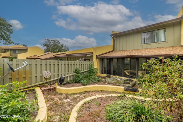 back of property featuring a sunroom