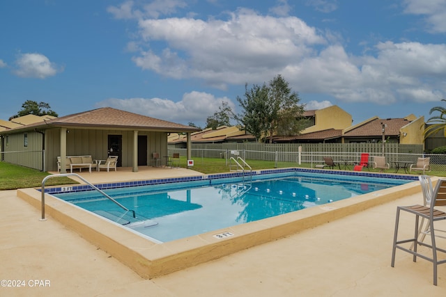 view of pool featuring outdoor lounge area and a patio area