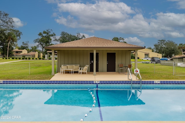 view of pool featuring a yard and a patio area