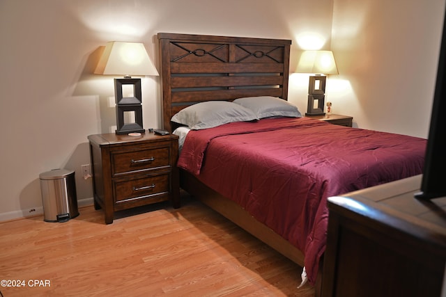 bedroom with light hardwood / wood-style flooring