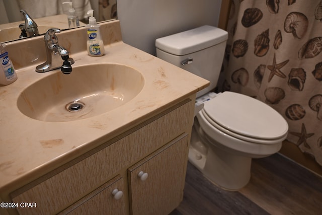 bathroom featuring hardwood / wood-style flooring, vanity, toilet, and a shower with shower curtain