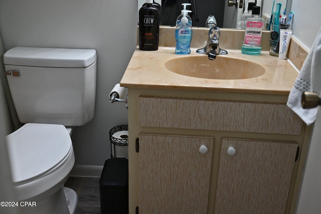 bathroom featuring vanity and toilet