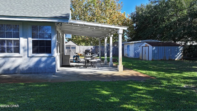 view of yard featuring a shed and a patio area