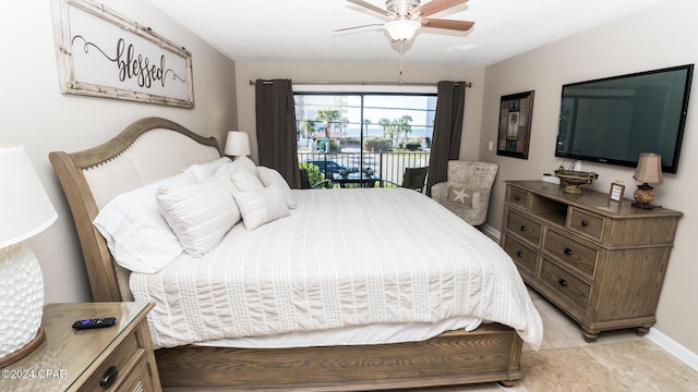 tiled bedroom with access to outside and ceiling fan