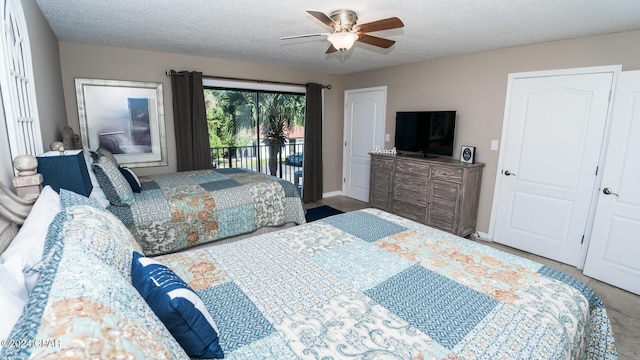 bedroom with ceiling fan, a textured ceiling, and access to outside