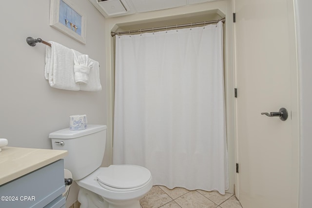 bathroom featuring vanity, toilet, and tile patterned flooring