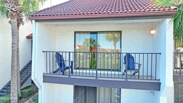 view of home's exterior with a balcony