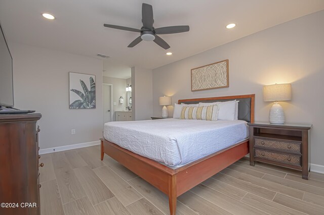 bedroom with ceiling fan and ensuite bathroom