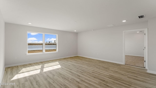 spare room with light wood-type flooring