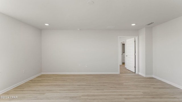 unfurnished room with light hardwood / wood-style flooring