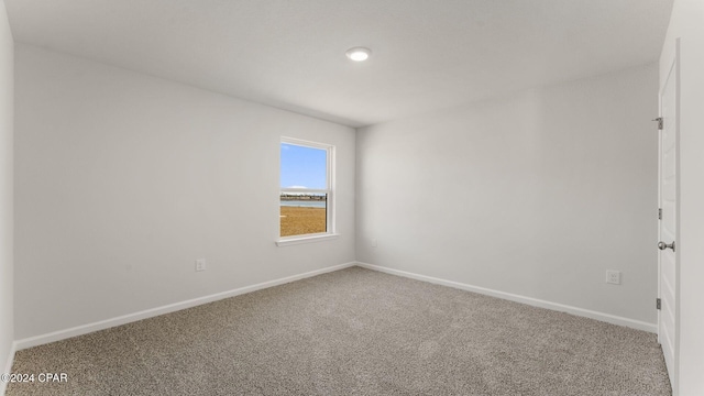 unfurnished room with carpet flooring