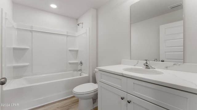 full bathroom featuring shower / tub combination, toilet, vanity, and hardwood / wood-style flooring