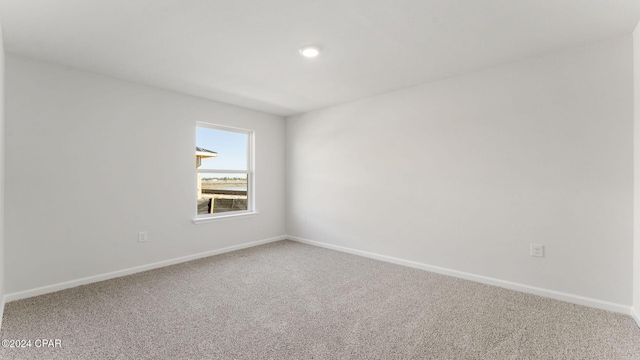 empty room with carpet flooring