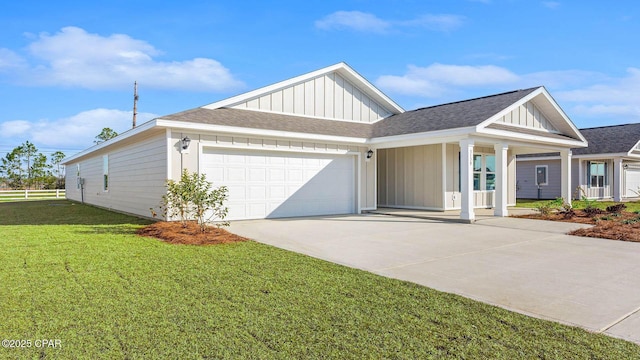 view of front of property with a garage and a front yard