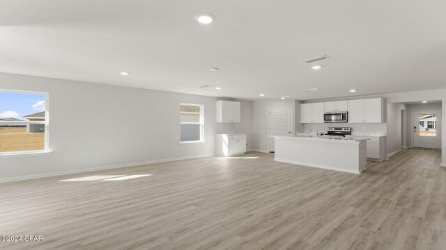 empty room featuring carpet and a water view