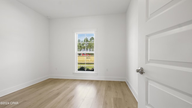 unfurnished room featuring light hardwood / wood-style floors