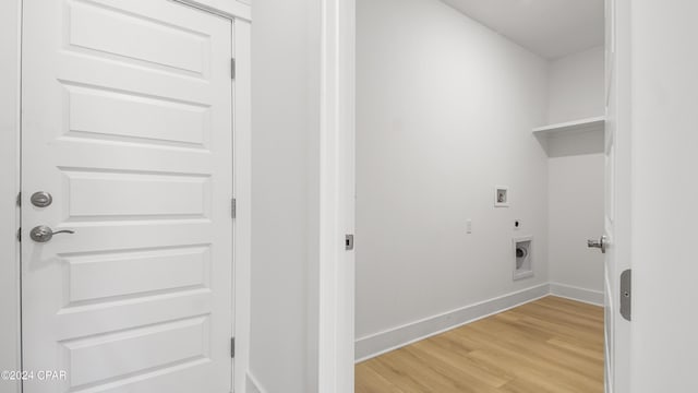 laundry area with hookup for an electric dryer, washer hookup, and light hardwood / wood-style floors