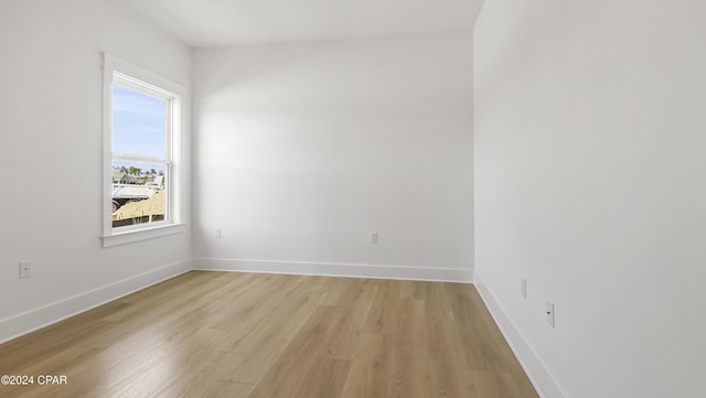 spare room with light hardwood / wood-style floors