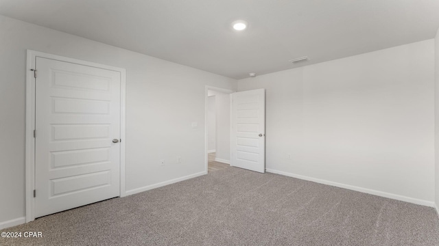 unfurnished room with carpet flooring