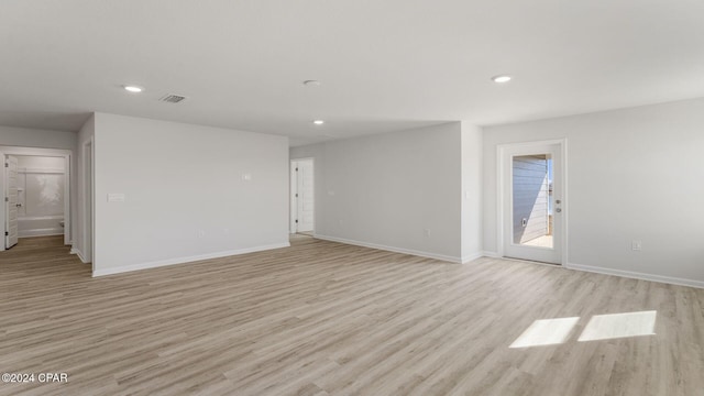 spare room with light wood-type flooring