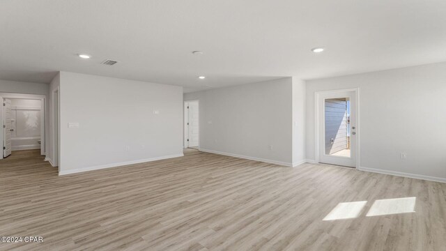 unfurnished living room featuring light hardwood / wood-style floors