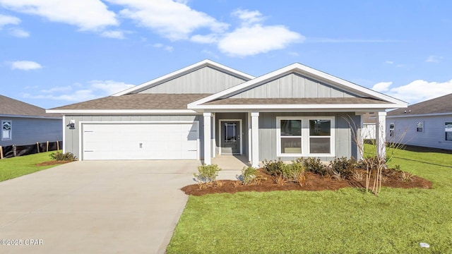 view of front of property featuring a garage and a front yard