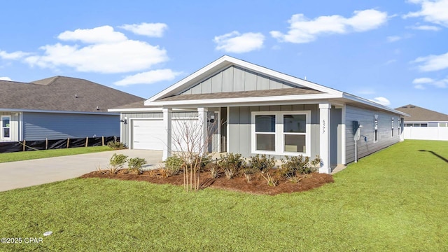 view of front of home featuring a garage and a front yard