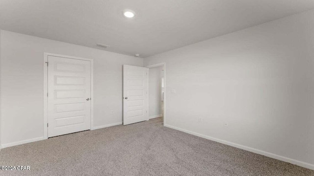 unfurnished bedroom featuring carpet flooring