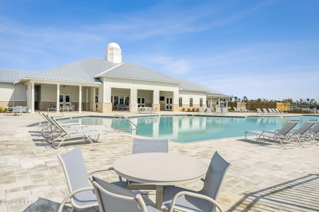 view of swimming pool featuring a patio