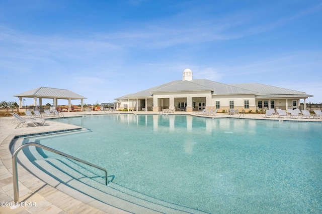 view of swimming pool with a gazebo and a patio area