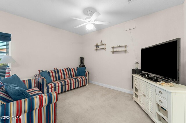 carpeted living room featuring ceiling fan