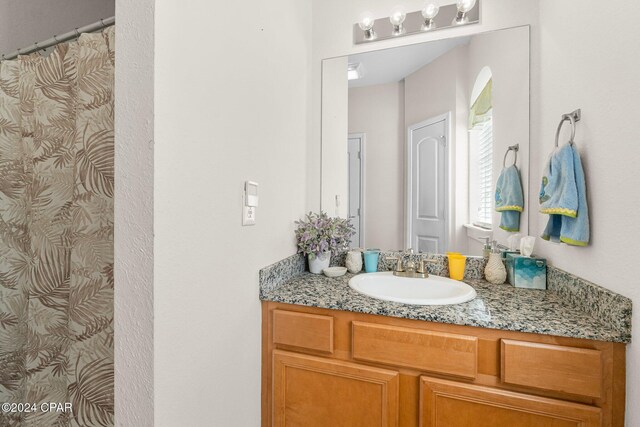 bathroom with vanity and walk in shower