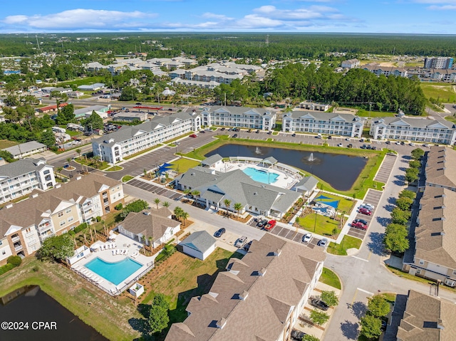 birds eye view of property featuring a residential view and a water view