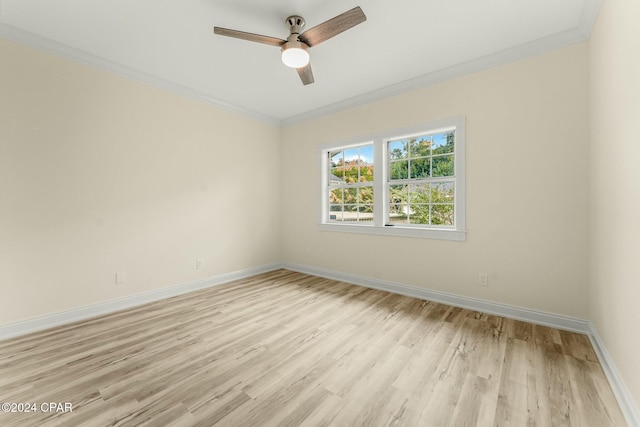 unfurnished room with ceiling fan, light wood-type flooring, and crown molding