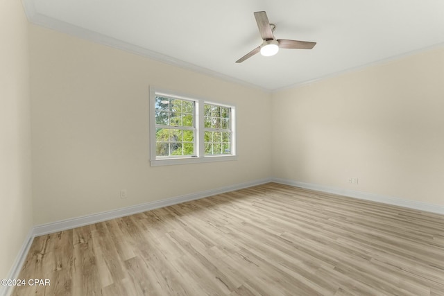 unfurnished room featuring light hardwood / wood-style flooring, ceiling fan, and ornamental molding