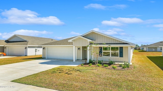 view of front of house with a garage and a front yard