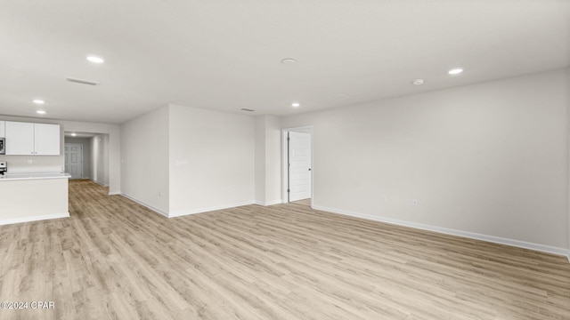 unfurnished living room featuring light hardwood / wood-style flooring