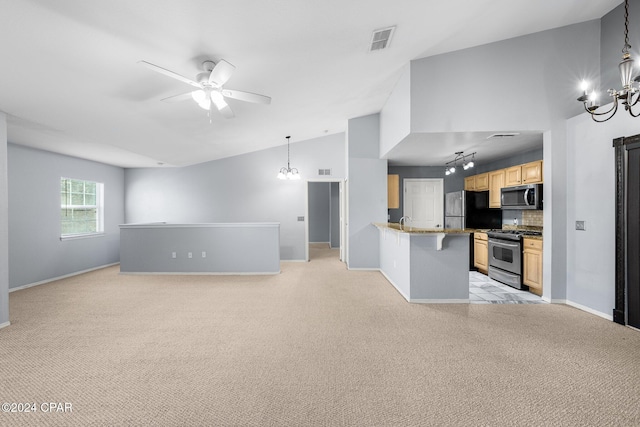 interior space featuring ceiling fan with notable chandelier, light colored carpet, and high vaulted ceiling